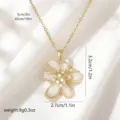 Elegant gold titanium steel necklace with a rotating white enamel flower pendant - Style 80476 (Pendant with Stainless Steel Chain)