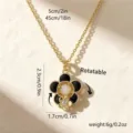 Rotatable camellia flower pendant necklace with black enamel petals and gold chain. - Black Camellia Pendant (80445) / With Stainless Steel Chain