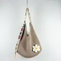 Khaki crochet shoulder bag featuring colorful strap and white flower, casual knit hobo bag. - Large Flower Pattern / Light Khaki