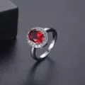 Elegant oval red zircon ring with halo diamond setting for women fashion jewelry. - Size 5.25 / Blue