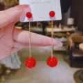 Detail view of elegant red pearl drop earrings with gold chains and S925 silver posts. - 7cm / Gold Cherry Red