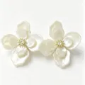 Close-up of elegant pearlescent white flower stud earrings with sparkling center - Gold Flower Stud Earrings (E5538) / White