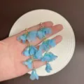 Elegant blue fabric flower drop earrings designed for a gentle summer beach vacation style. - Fabric Tassel Flower Style (E5329) / Sky Blue