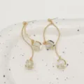 Detailed macro view of French vintage cat-eye stone tassel earrings in gold finish - French Long Cat Eye Stone Tassel Style (E0115)