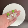 Elegant white floral stud earrings with green beads, perfect for summer vacation. - Green Beaded White Flower Pendant (E5393) / Gold