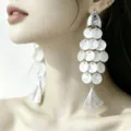Elegant fish-shaped tassel earrings with white pearlescent discs and evil eye detail - Fish Shape Evil Eye Tassel Style / Silver White (E5311)
