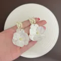 Elegant white floral earrings with golden textured square studs for women - Gold White Style (E3922)