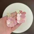 Elegant pink pearlescent flower stud earrings with gold textured square accents for women. - Gold Pink Style (E3922)