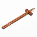 Handcrafted Japanese wooden chopsticks with geometric pattern and matching rest - Style 09 (Red White Brown Geometric Decal)