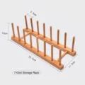 7-slot bamboo storage rack for kitchen plates and tea cakes, dimensions 32.5cm by 11.5cm - 7 Slots