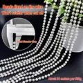 Detailed macro view of 6mm white faux pearl bead chain for DIY wedding decoration. - 6mm Pearl Chain (500g Pack) / Off White