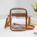 Transparent waterproof PVC crossbody bag with stylish brown trim for travel and storage - Tan