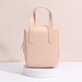 Elegante pfirsichfarbene wasserdichte Kosmetiktasche aus PU mit robustem Tragegriff oben - Handheld-Stil (9098) / Hellrosa