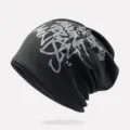 Trendy black hip-hop beanie hat featuring grey graffiti lettering, lightweight unisex style - One Size / Unlined / Black