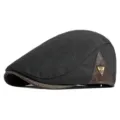 Vintage black wool newsboy cap with brown leather patchwork and unique metal logo detail - One Size (55-59cm) / Patchwork Metal Badge / Patchwork Metal Badge-Black