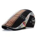 Vintage patchwork beret flat cap with embroidered script detail and leather texture - One Size / Appliqué / Black