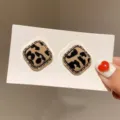 Close-up detail of leopard print fabric texture on vintage gold-tone square stud earrings - Square Leopard Flocking Style (E4401) / Gold (E4401)
