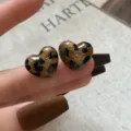 Close-up of heart-shaped earrings featuring a stylish brown leopard print pattern - Heart Flocked Leopard Style (E5033) / Leopard Brown Black (E5033)