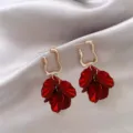 Close-up of elegant French style earrings with deep red petal pendants - Petal Pendant Drop Earrings (E3292)