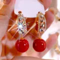 Detailed macro shot of red bead drop earrings with sparkling teardrop crystal settings - Waterdrop Full Rhinestone Drop Style (E3820) / Gold Red
