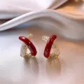 Elegant Ankora red cross earrings featuring sparkling pave crystals and gold plating finish - Crossed X Rhinestone Style (E3802) / Gold Red