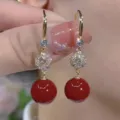 Elegant gold earrings with clear sparkling stones and bold red sphere drops for women. - Geometric Cut Rhinestone Drop Style (E3822) / Gold Red