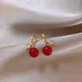 Elegant Ankara red round drop earrings with gold-tone accents on silk background - Twist Knot Rhinestone Red Bead Style (E3868) / E3868 Gold Red