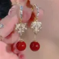Close-up of French retro leaf earrings with elegant red beads and opal-like stones - Leaf Cluster Red Round Bead Style (E4578)