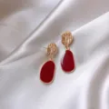 Elegant French vintage style drop earrings featuring a deep anchora red enamel finish - Hollow Grid Ball Style (E0098) / Gold and Burgundy