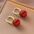 Elegant French retro gold hoop earrings featuring large round Ankara red beads - U-Shaped Buckle Round Bead Earrings (E3447)