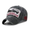 Vintage washed cotton baseball cap with distressed edges and embroidered story patch detail - 56-59cm / 1964 Style / Black