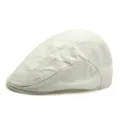 Classic off-white cotton newsboy cap with structured design and short brim for unisex wear - Off White