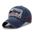 Premium vintage blue washed cotton baseball cap featuring distressed letter patch embroidery - 56-59cm / 1964 Style / Dark Blue