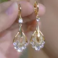 Exquisite close-up of gold mesh teardrop earrings with shimmering round crystals - Gold Teardrop Mesh Lady Hook (E4935金)