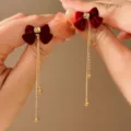 Elegant vintage red velvet bow earrings with long gold tassel and bead drop detail - Red Flocked Bow Tassel Style (E2684)