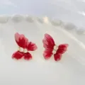 Elegant Anchora red butterfly stud earrings featuring sparkling zircon crystal accents - Butterfly Shape Style (E4100) / Ancorra Red