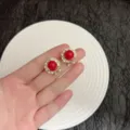 Elegant red bead stud earrings with sparkling crystal border in gold-tone finish - Round Pavé Ear Clip (E4144) / Light Red