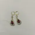 Elegant gold-plated drop earrings with pear-cut red stone and sparkling rhinestones. - Pear-Shaped Gemstone Drop Style (E2981) / Gold Red