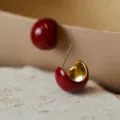 Elegant Ankora red stud earrings with glossy gold interior for autumn winter fashion. - E4312 Red (Vintage Red & Gold Half-Sphere Drop Earrings)