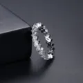 Sparkling silver geometric eternity ring featuring emerald-cut cubic zirconia crystals - Size 6 / Silver