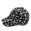 Black and white casual baseball cap featuring a stylish all-over skull print pattern - Adjustable (55-59cm) / Baseball Cap / Black with White Skulls