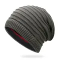 Grey slouchy reversible knitted beanie with ribbed texture and striped interior for winter - One Size / Dark Gray