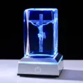 Detailed view of 3D laser engraved Jesus on cross in blue glowing crystal night light - Jesus Crucifix Style