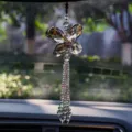 Close-up of sparkling butterfly crystal car hanging ornament with beaded tassels. - Three-Layer Maple Leaf - Tea Brown