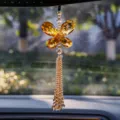 Close-up detail of luxurious amber crystal butterfly car pendant with beaded tassel - Three-Layer Maple Leaf - Champagne