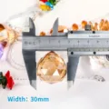 30mm champagne K9 crystal faceted ball pendant shown with caliper measurement - Champagne Ball (Style 4) / 30mm