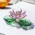 Close-up of a pink crystal lotus flower ornament with elegant light refraction. - Double Lotus Leaf Lotus Ornament / Pink