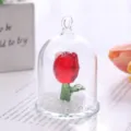 Close-up of a red faceted crystal rose preserved in a clear glass dome - Red Rose Ornament / Red