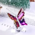 Macro view showing the exquisite faceted detail of a purple crystal butterfly gift - Butterfly Design / Brown Red