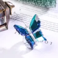 Detailed close-up of a blue gradient crystal butterfly ornament with faceted wings - Butterfly Design / Fruit Green
